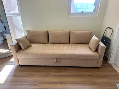 IKEA Beige Fabric 3-Seater Sofa Bed under storage