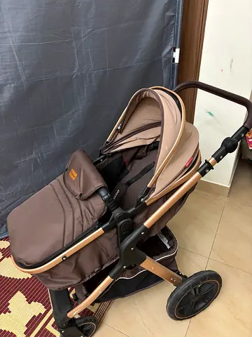 Almost new convertible pram strolling