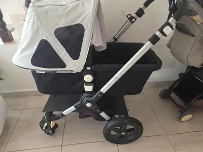 Bugaboo-style bassinet stroller frame with bassinet - excellent condition