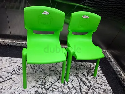Set of 2 green children's plastic chairs - lightweight and stackable