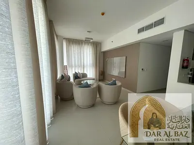 A stunning furnished apartment with a sea view in a prime location (Ajmal Makan City, Sharjah). Features: 2 master bedrooms, a living room, parking,