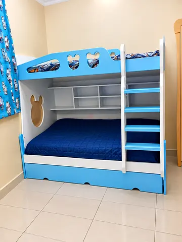 Blue and white wooden bunk bed with storage and ladder - good condition