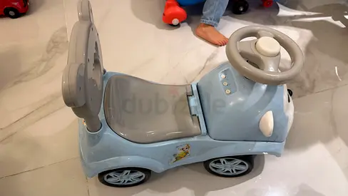 Blue Ride-On Toy Car with Steering Wheel and Sound Buttons - Good Condition