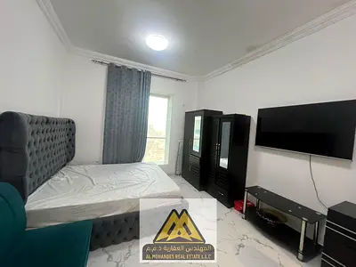 Large studio apartment/partially furnished kitchen/fully furnished/free parking/in Al Waha Towers, Rashidiya 1, close to all services and roads