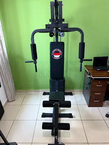 Home multi-gym station with lat pulldown and leg developer - used