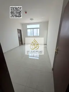 Two-bedroom apartment with a living room on the Ajman Corniche; annual rent, first-time occupancy, i