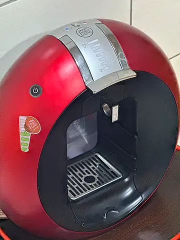 Red single-serve capsule coffee machine - working condition
