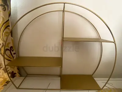 Round metal wall shelf with three tiers - gold finish