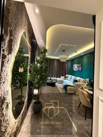 Two-bedroom apartment with a living room for sale in Ajman One Towers, including furniture.