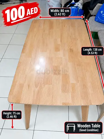 Wooden dining table 138x80cm, good condition - AED 100