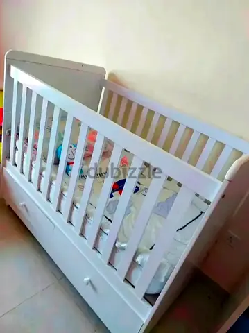 White wooden baby cot/crib with storage drawers - good condition