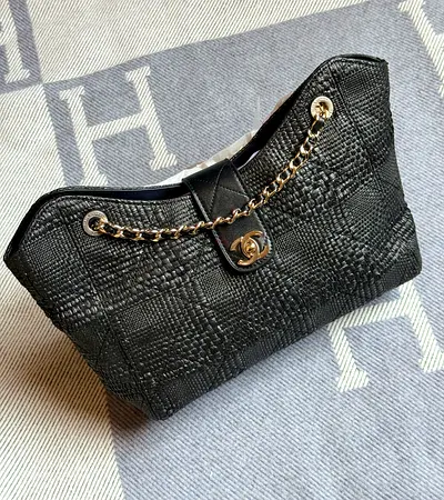 Black quilted Chanel-style chain shoulder bag