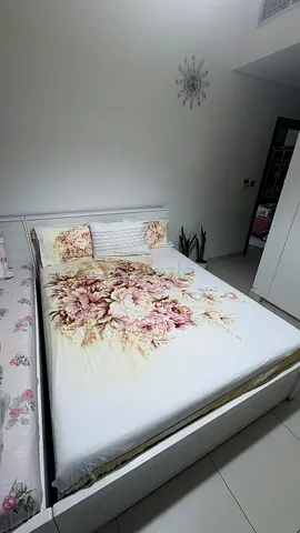 White wooden queen bed without matress