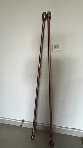 Curtain rods and wooden piece