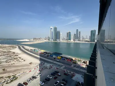 For monthly rent: a room and living room with hotel-style furnishing and a sea view in Al Mamzar, Sharjah.
