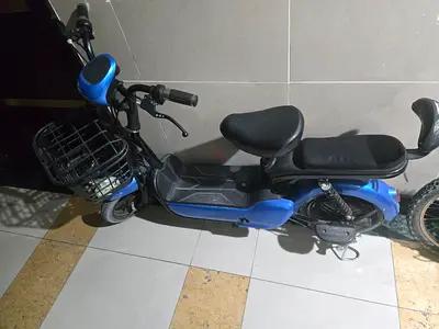 Used Blue Electric Scooter with Double Seat and Front Basket - Good Condition