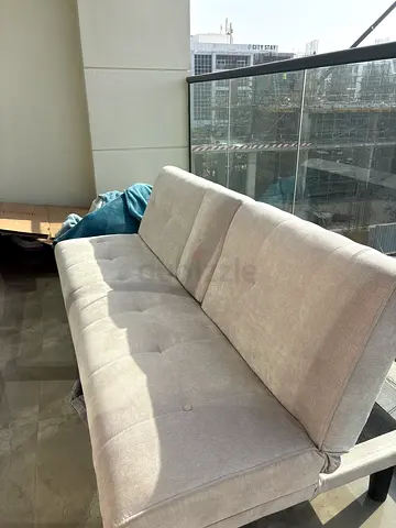 grey medium sized sofa bed
