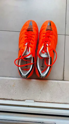 Bright orange men's football/soccer cleats - lightly used