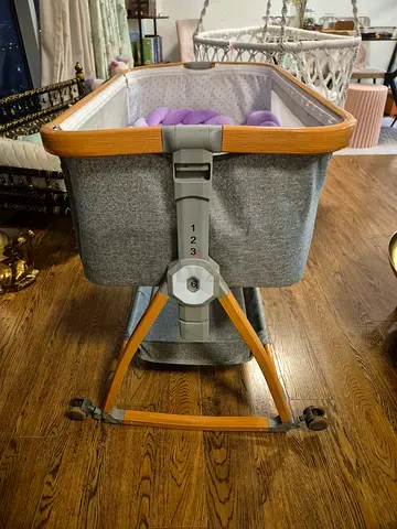 Wooden frame baby bassinet with grey fabric - gently used