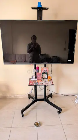 40-55 inch TV on Mobile Rolling Stand with Shelf - Good Working Condition