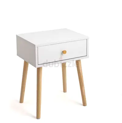 White bedside table with single drawer and wooden legs