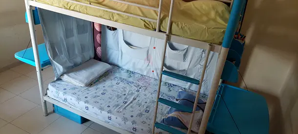 White metal bunk bed with lower mattress and slide - good condition