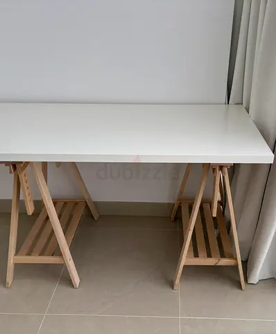 White tabletop 1.8m desk with wooden trestle legs. IKEA. Tabletop can be sold separately.
