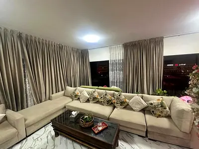 Large beige L-shaped sofa set with cushions - good condition
