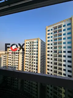 2BR apartment for annual rent in Pearl Towers, Ajman. 2 bathrooms, balcony, parking, AED 35,000 year