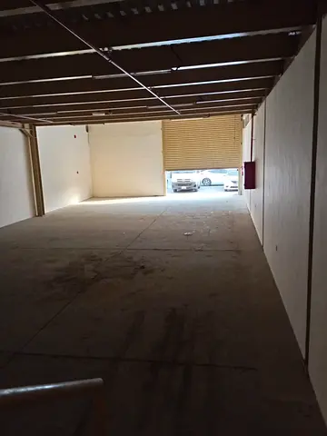 Warehouse complex for rent – various sizes | Mezzanine | 20 kW electricity | Al-Jurf Industrial Area 1 – prime location.