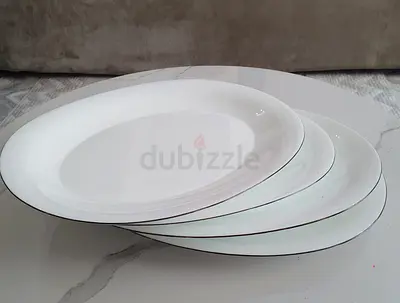 Set of 4 white rimmed oval serving plates - good condition