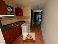 A spacious studio with a separate kitchen, central AC, and free owner-covered maintenance, located i