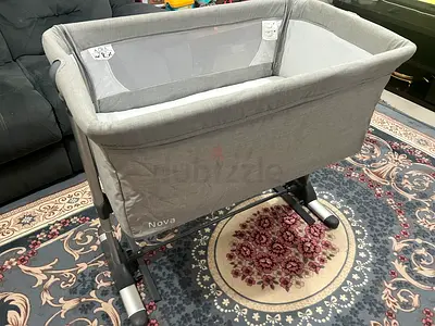Jikel Baby Bedside Crib – Adjustable, Rocking, Mesh Sides (Like New)