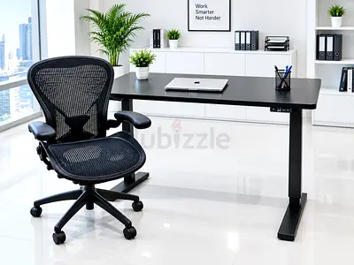 Herman Miller and Height-adjustable standing desk with black top — modern office table