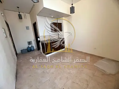 Studio for Annual Rent in Al Qulaiya Sharjah Spacious Layout Large Bathroom Good Kitchen Clean Building Free Sandy Parking 4 Payments Cheque Deposit