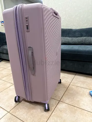 Light purple hard-shell spinner suitcase with TSA lock - good condition