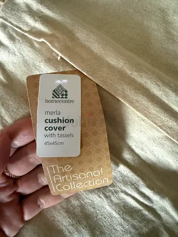 Two cushion covers. New. Label attached