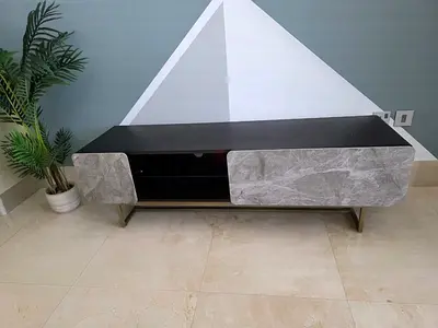 Low modern TV cabinet with marble-effect doors