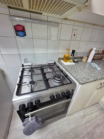 Mildly used stainless steel gas oven with 4-burner hob - great working condition