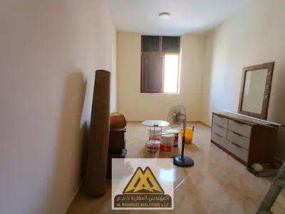 One-bedroom apartment with a living room for annual rent in Al Aliyah, Ajman | 2 bathrooms | Central A/C | Free maintenance (landlord-covered) | Close