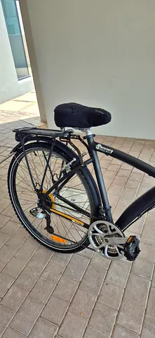 Two BTWin Used hybrid/commuter bikes with rear rack and lights - good condition