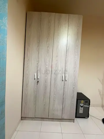 Light wood 4-door wardrobe with lock — good condition