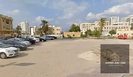 Two-street corner plot on main Saif Al Hamrani Street in Al Bustan, residential and commercial, G+6,