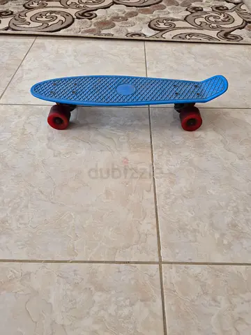 Used small  cruiser skateboard (penny-style) with red wheels