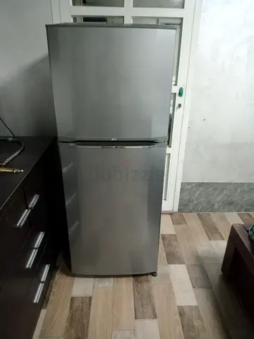 Silver double-door refrigerator - good working condition