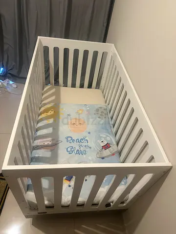 White baby crib without mattress — solid wooden cot in good condition