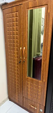 Two-door wooden wardrobe with mirror — good condition