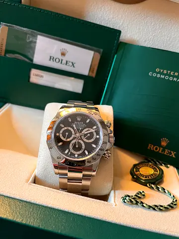 Rolex 116520 year 2016 box and papers.
