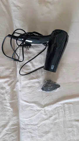 Compact used black hair dryer with nozzle attachment