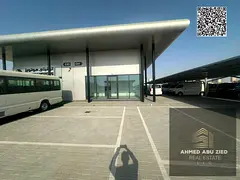 Car showrooms for rent in Ajman with direct frontage on Mohammed Bin Zayed Road; first‑use units w